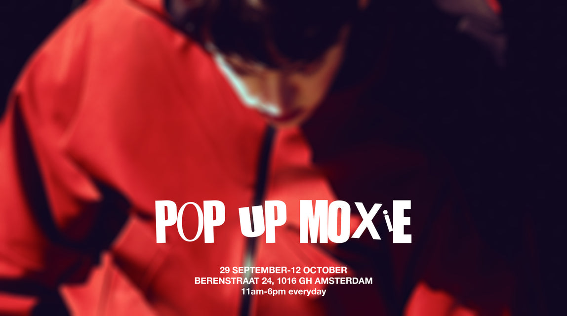 Promotional poster for a rainwear pop-up event in Amsterdam, The Netherlands