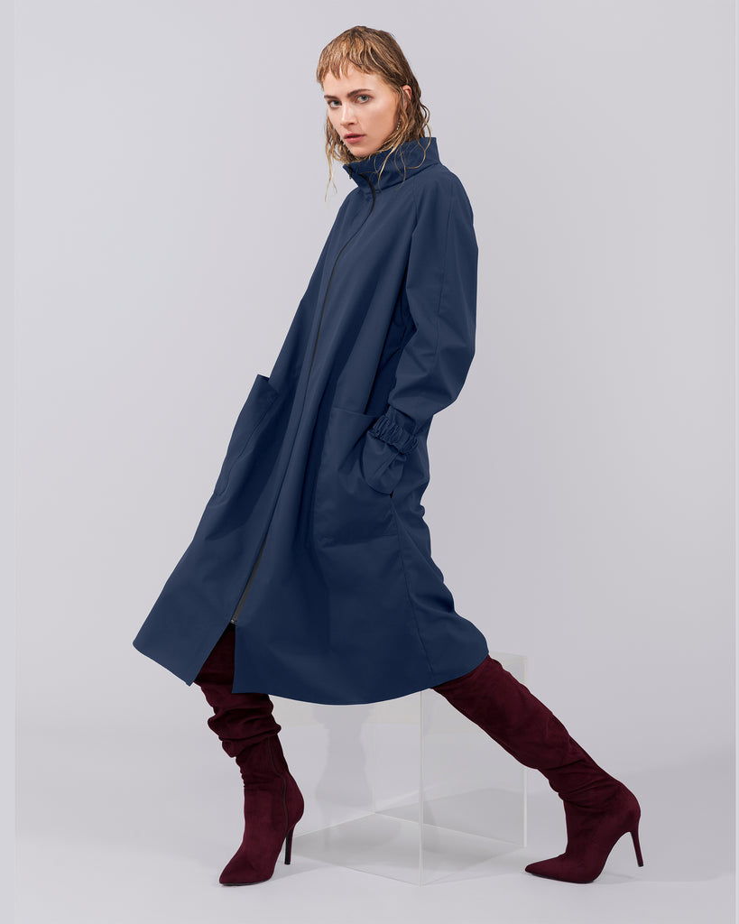 blue, light-weight, zipped, mid length BYBROWN raincoat