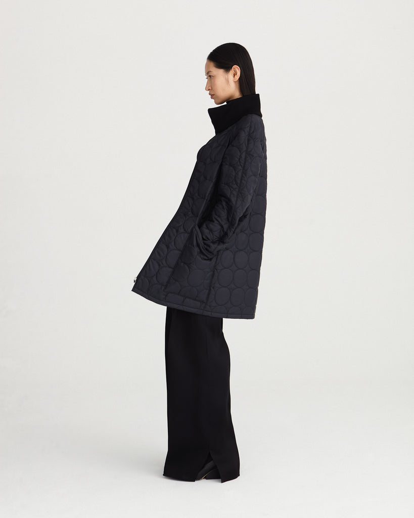 sustainable, zipped, black, detachable liner for raincoat made from 100% recycled polyester