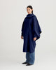 Navy blue, waterproof, breathable, technical, sustainable and packable raincoat poncho suitable for cycling