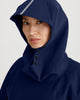 Close up of hood of navy blue, waterproof, breathable, technical, sustainable and packable raincoat poncho suitable for cycling