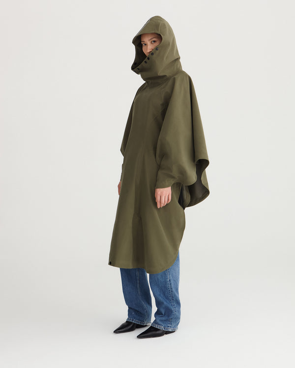 Army green, waterproof, breathable, technical, sustainable and packable raincoat poncho suitable for cycling