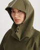 Close up of army green, waterproof, breathable, technical, sustainable and packable raincoat poncho suitable for cycling