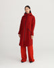 midlength, red, waterproof, breathable, sustainable and technical raincoat from recycled materials with hood.